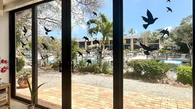a bathroom with a granite countertop sink mirror vanity and toilet
