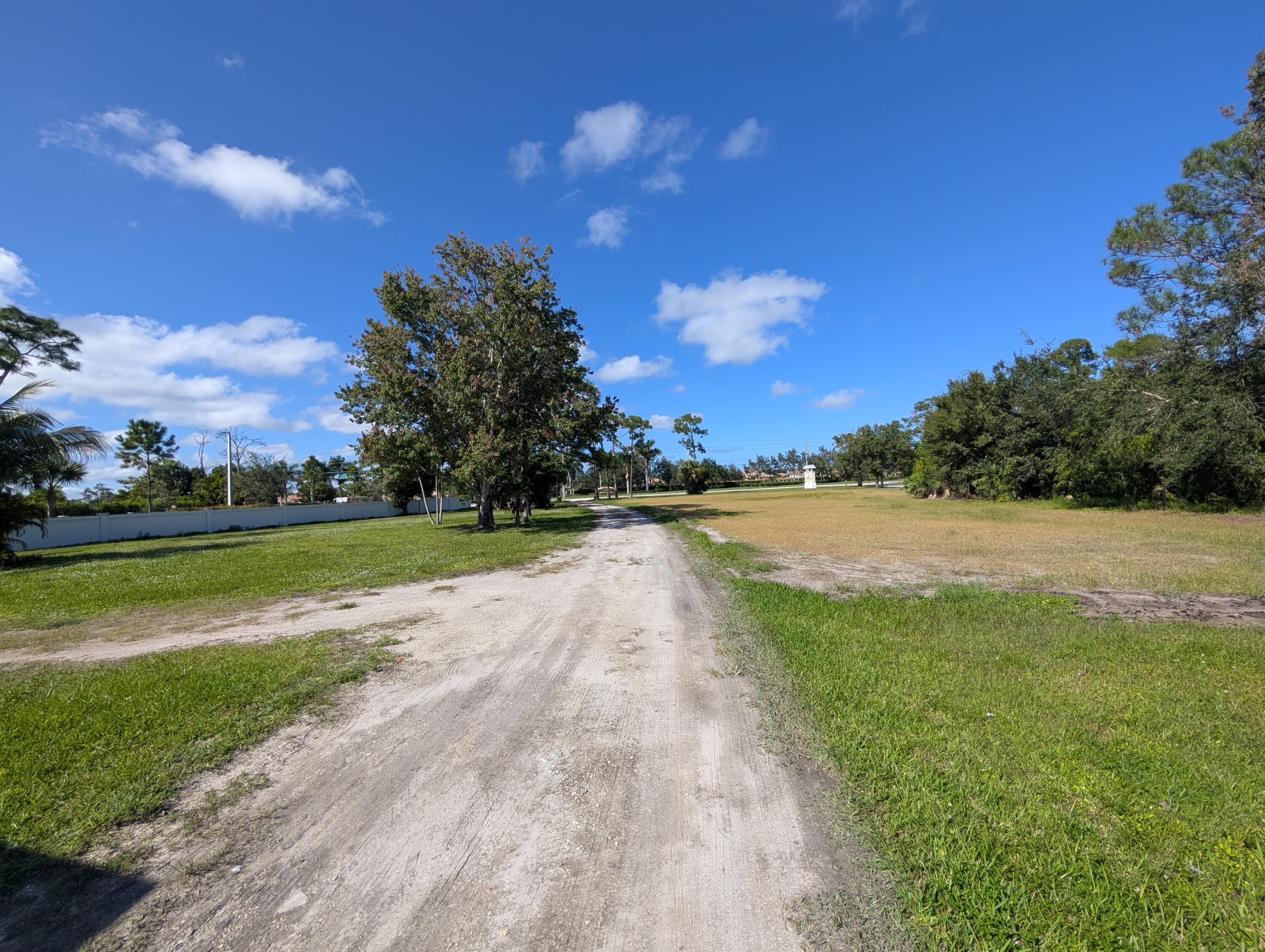 1500 Southeast Cove Road Stuart, FL 34997 - Photo 14 of 25 a view of yard with swimming pool and green space