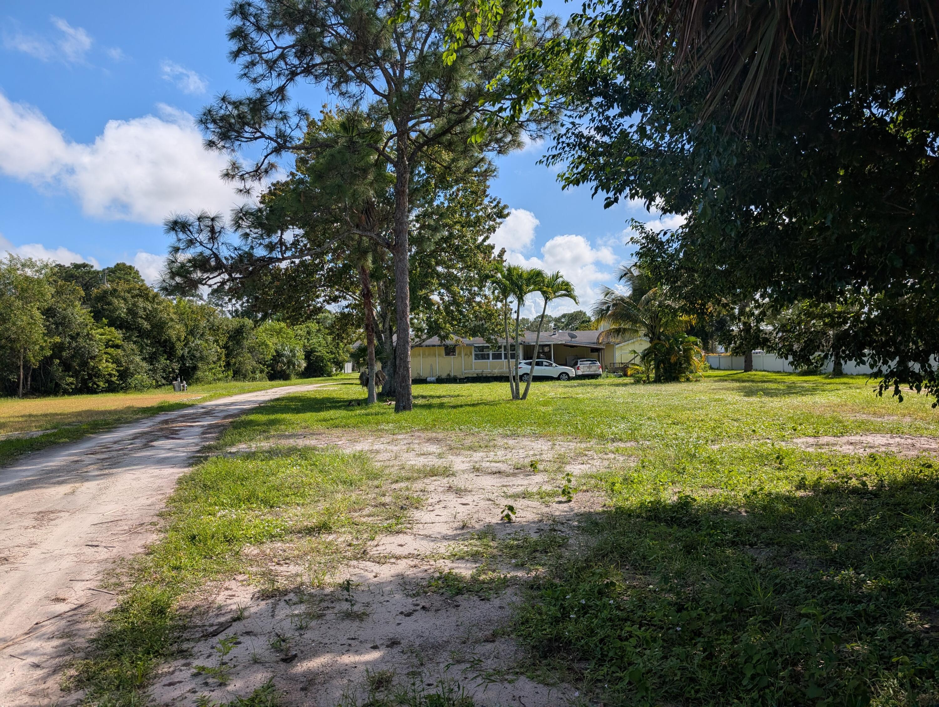 1500 Southeast Cove Road Stuart, FL 34997 - Photo 21 of 25 a view of a field with tree s