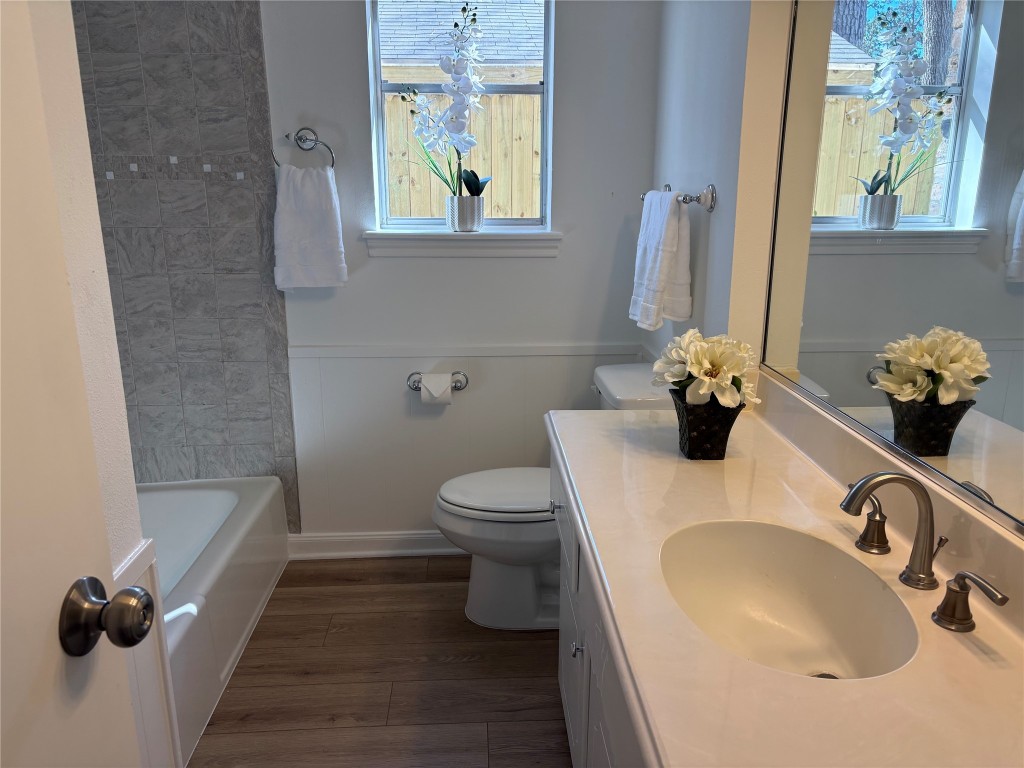 1111 Burning Tree Road Kingwood, TX 77339 - Photo 17 of 32 Bright and stylish guest bathroom featuring updated fixtures, a spacious vanity, and modern tile accents.