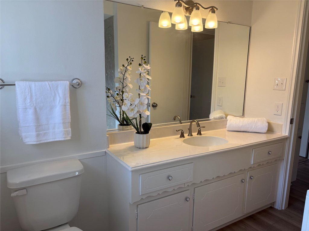 1111 Burning Tree Road Kingwood, TX 77339 - Photo 18 of 32 Elegant guest bathroom featuring a spacious vanity, updated fixtures, and a large mirror for a bright, inviting feel.