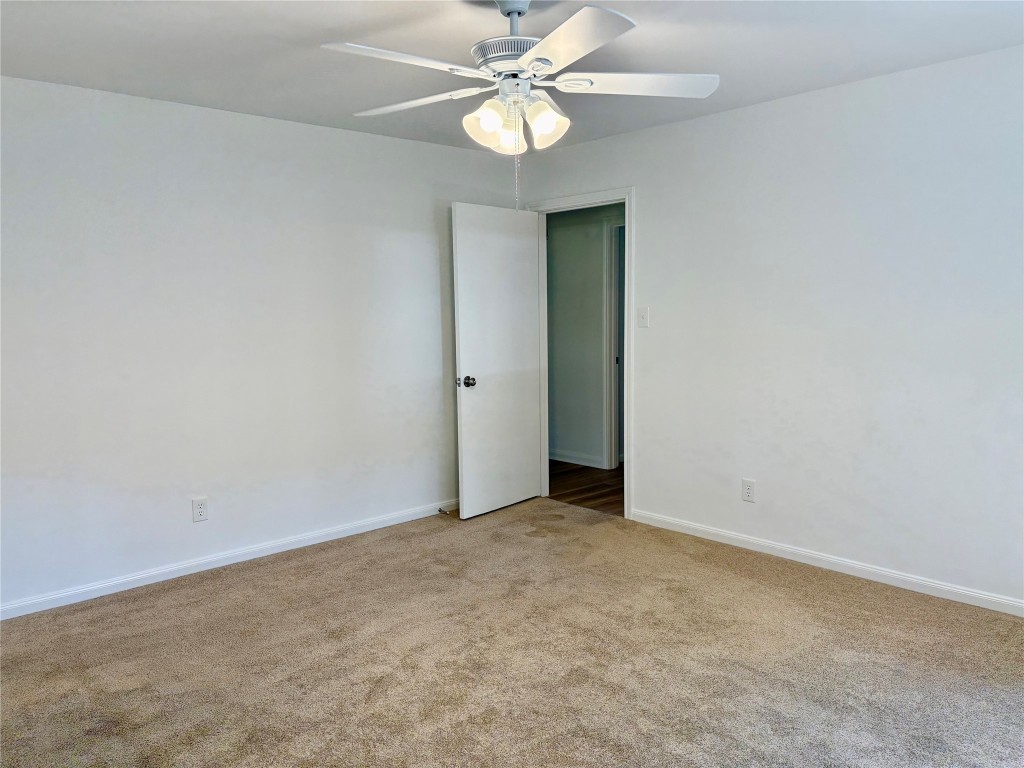 1111 Burning Tree Road Kingwood, TX 77339 - Photo 21 of 32 Enter the spacious primary bedroom from the hall.