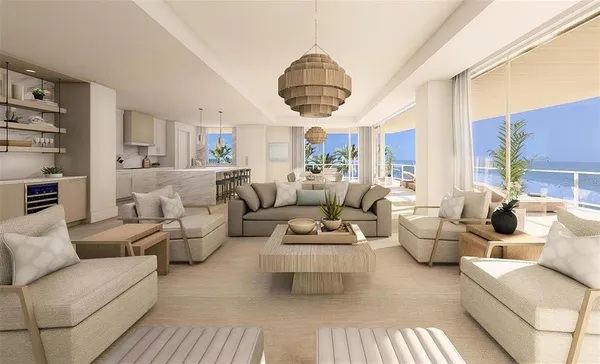 a living room with furniture a rug and a chandelier