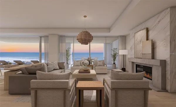 a living room with furniture fireplace and a large window