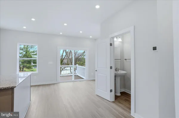 a kitchen with a sink stove and microwave