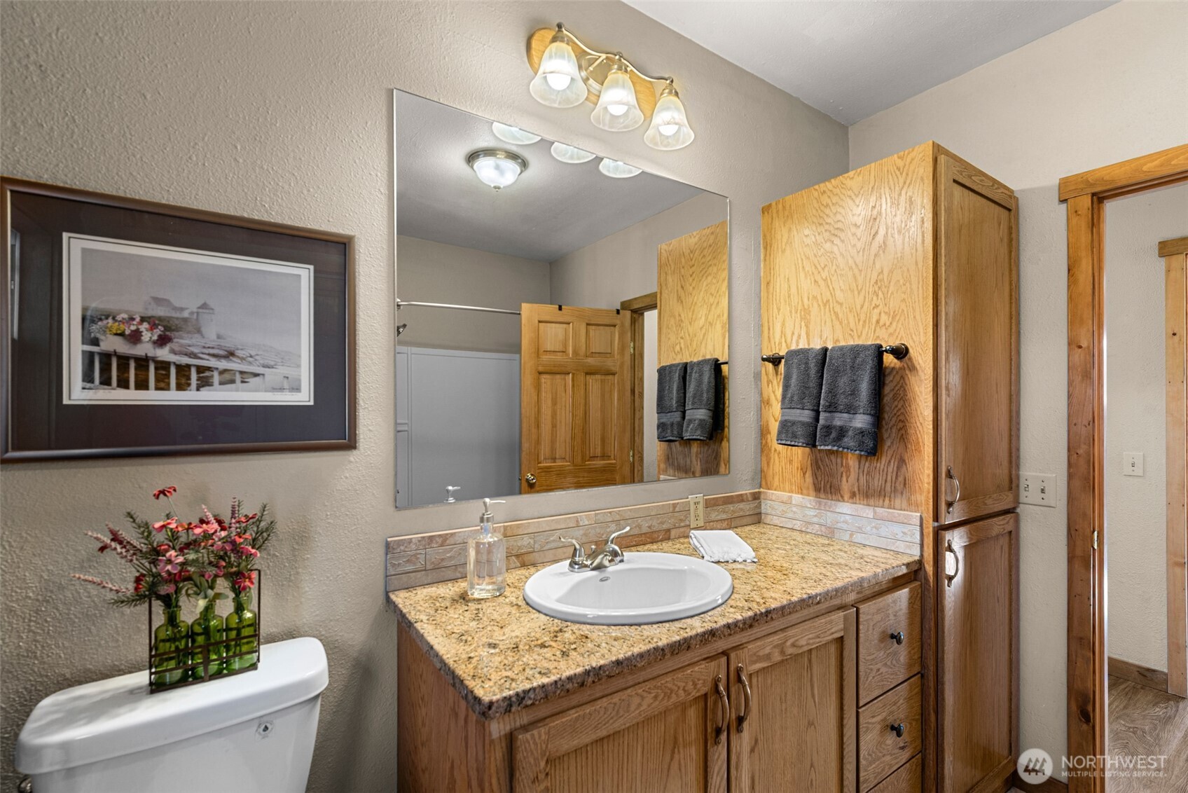 75 Purtteman Gulch Road Chelan, WA 98816 - Photo 16 of 40 a bathroom with a granite countertop sink and a mirror