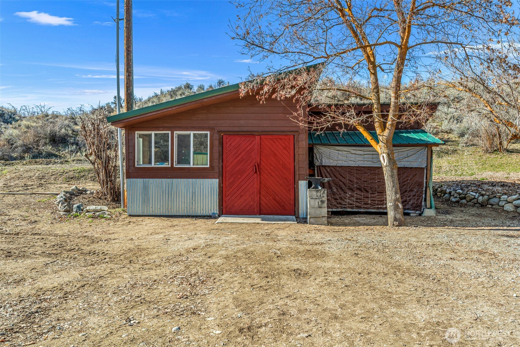 75 Purtteman Gulch Road Chelan, WA 98816 - Photo 24 of 40 a house that has a tree in front of it
