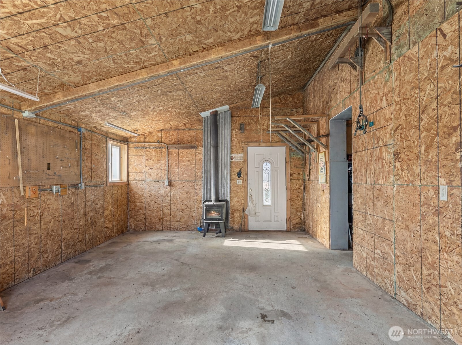 75 Purtteman Gulch Road Chelan, WA 98816 - Photo 33 of 40 a view of a house with a wooden fence