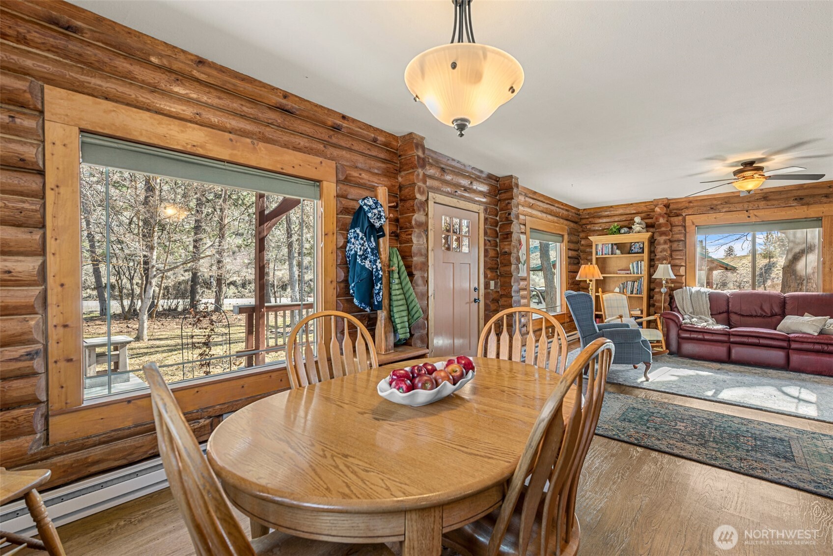 75 Purtteman Gulch Road Chelan, WA 98816 - Photo 7 of 40 a dining room with furniture a chandelier and wooden floor