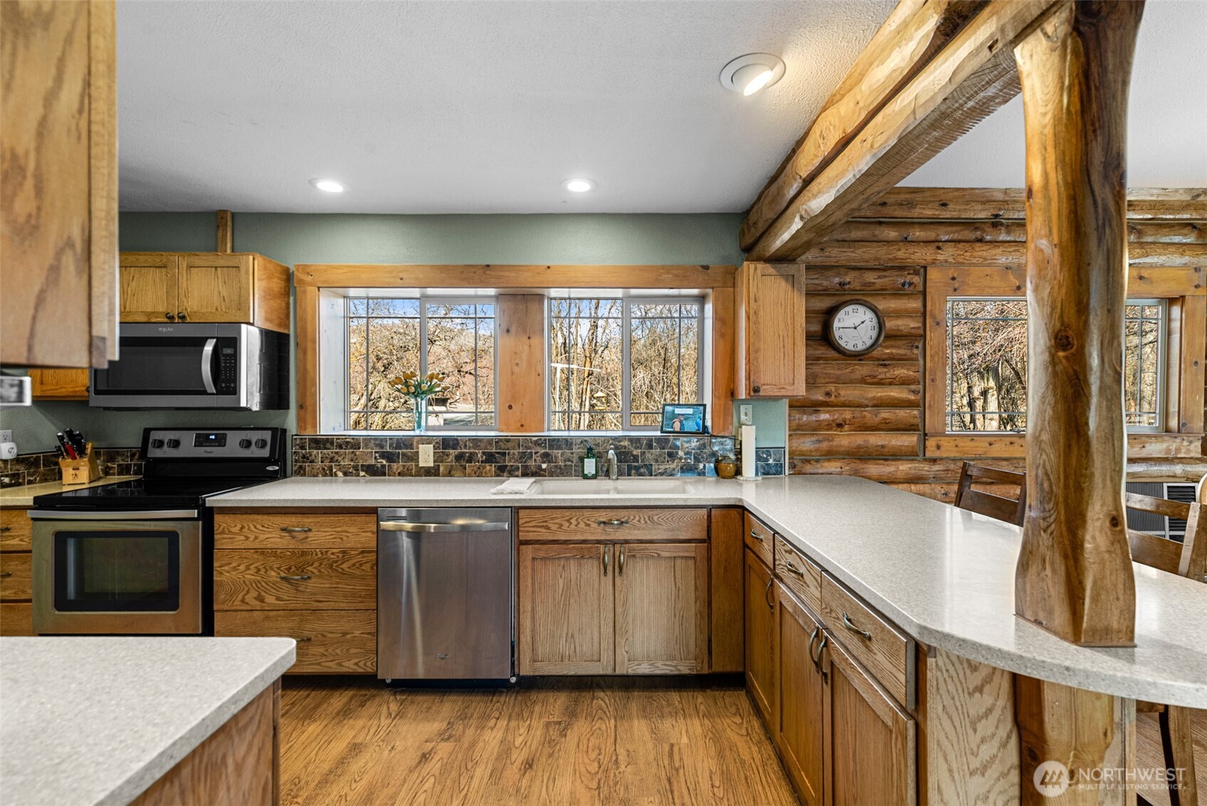 75 Purtteman Gulch Road Chelan, WA 98816 - Photo 10 of 40 a kitchen with lots of counter top space and wooden floor