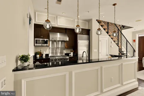 a view of a living room and chandelier