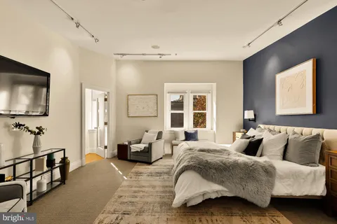 a bedroom with bed and window