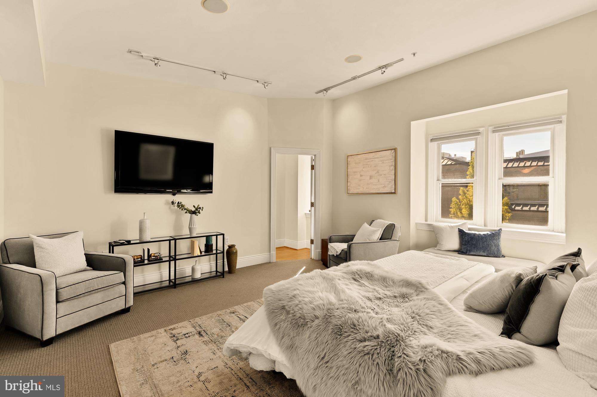 1533 P Street Northwest, Unit 5 Washington, DC 20005 - Photo 17 of 28 a bedroom with a bed and a flat screen tv