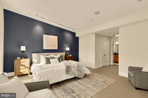 a bed room with a bed and a couch