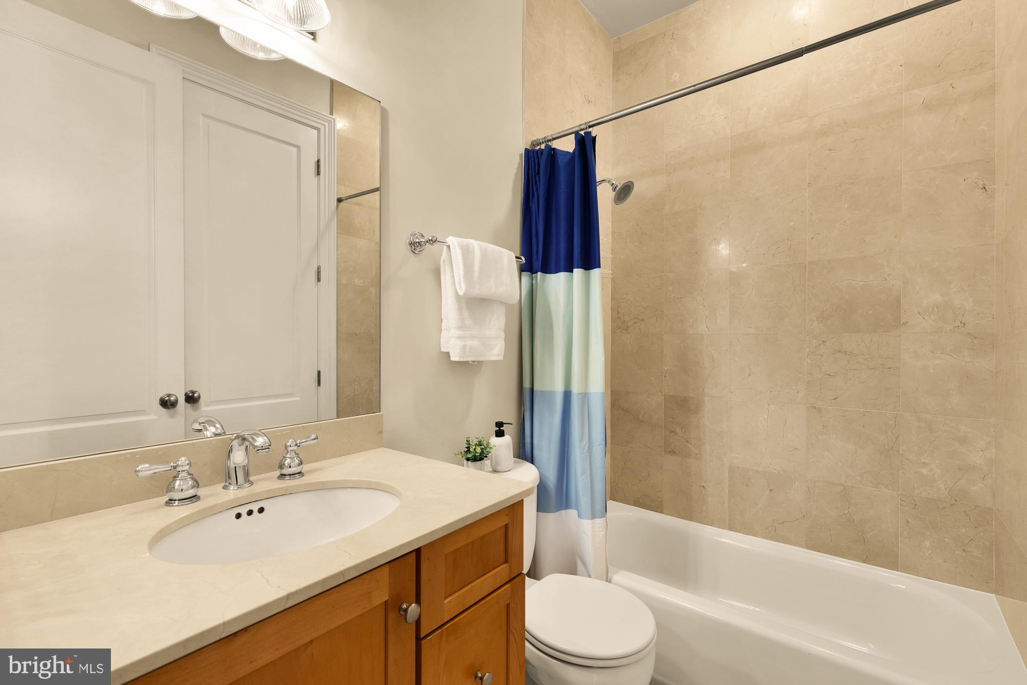 1533 P Street Northwest, Unit 5 Washington, DC 20005 - Photo 25 of 28 a bathroom with a sink a toilet and shower