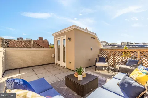 a view of a terrace with furniture