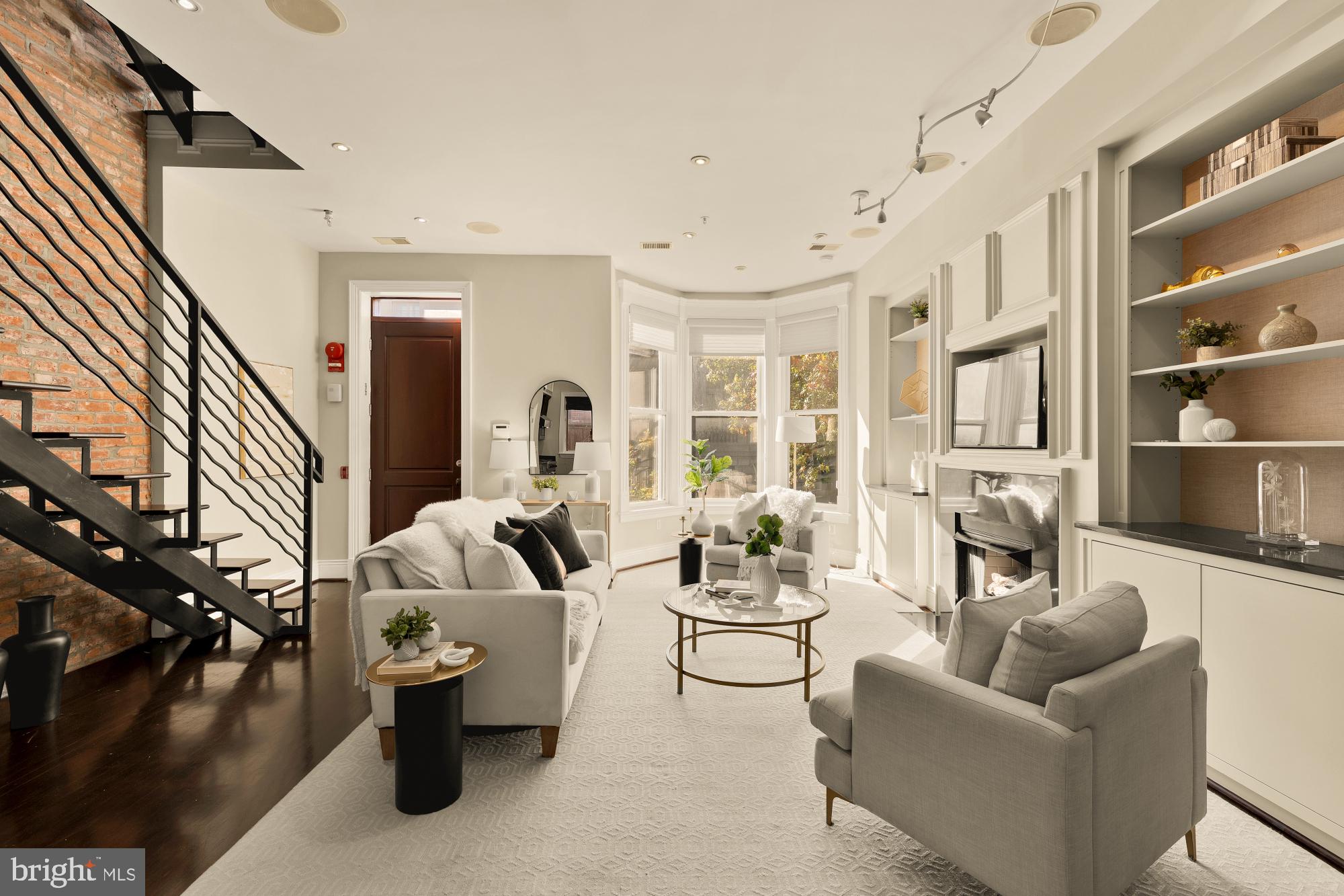 1533 P Street Northwest, Unit 5 Washington, DC 20005 - Photo 6 of 28 a living room with furniture fireplace and a large window