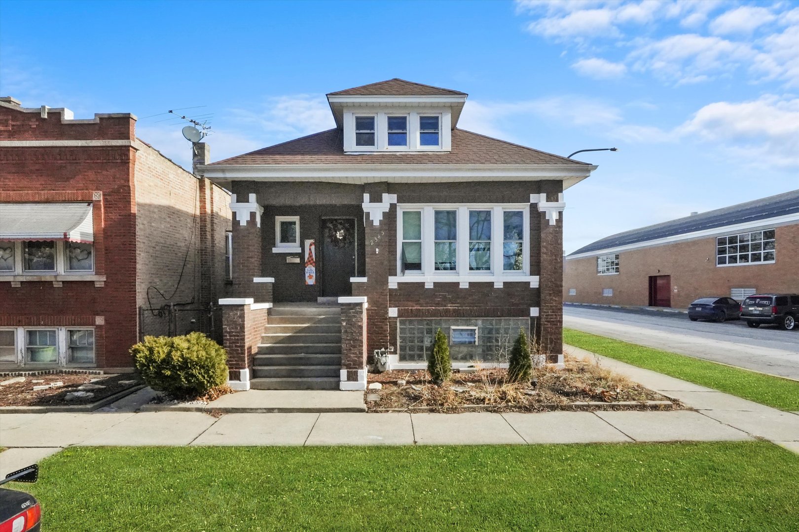 2345 South 59th Court Cicero, IL 60804 - Photo 1 of 36 a front view of a house with garden