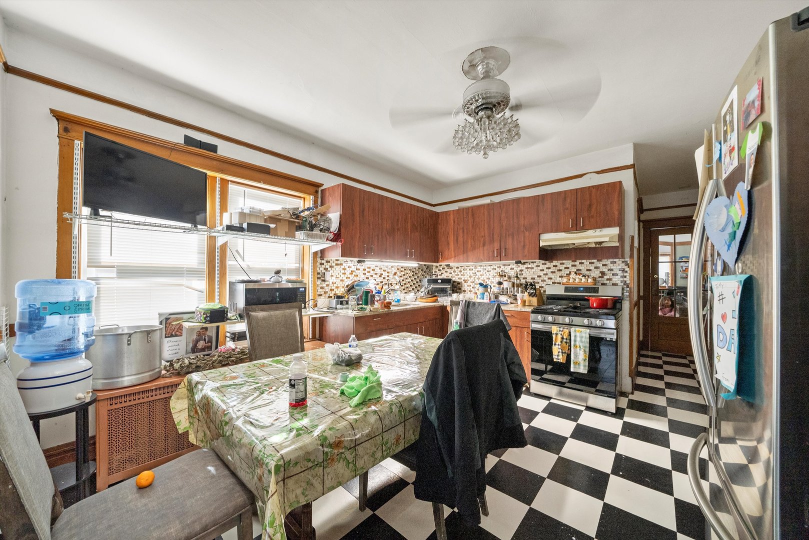 2345 South 59th Court Cicero, IL 60804 - Photo 11 of 36 a living room with stainless steel appliances furniture a rug and a large window