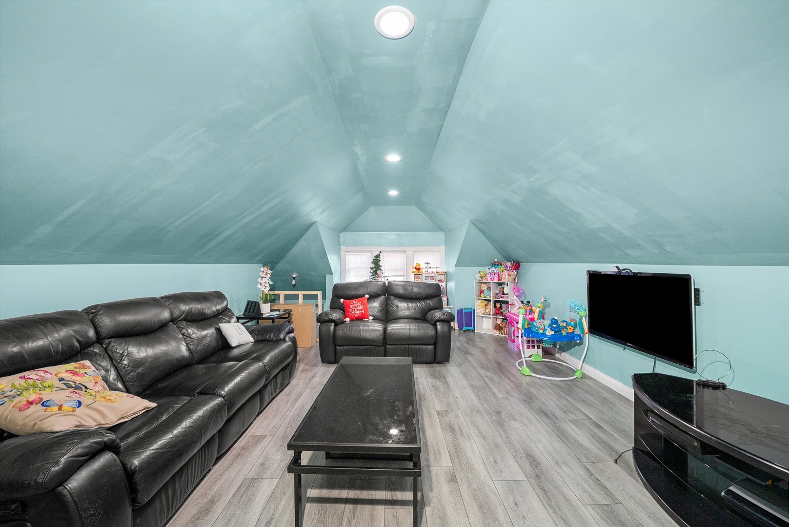 2345 South 59th Court Cicero, IL 60804 - Photo 19 of 36 a living room with furniture and a flat screen tv