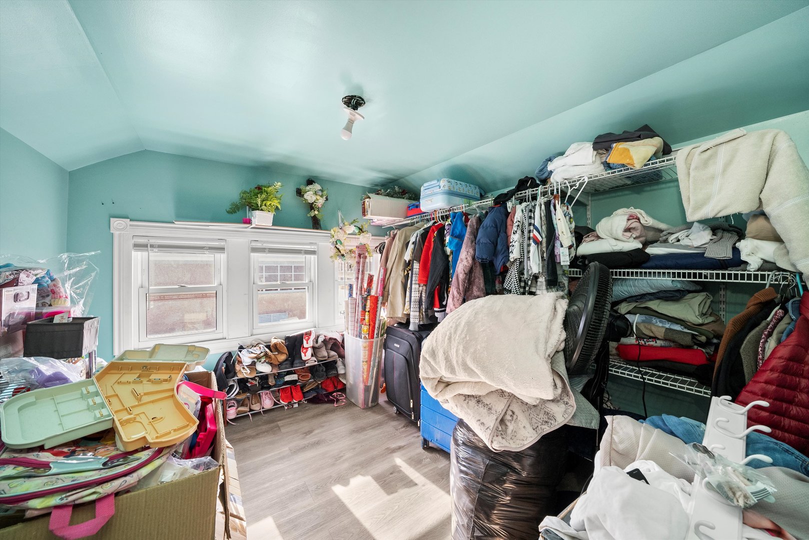 2345 South 59th Court Cicero, IL 60804 - Photo 22 of 36 a view of walk in closet with clothes and shoes