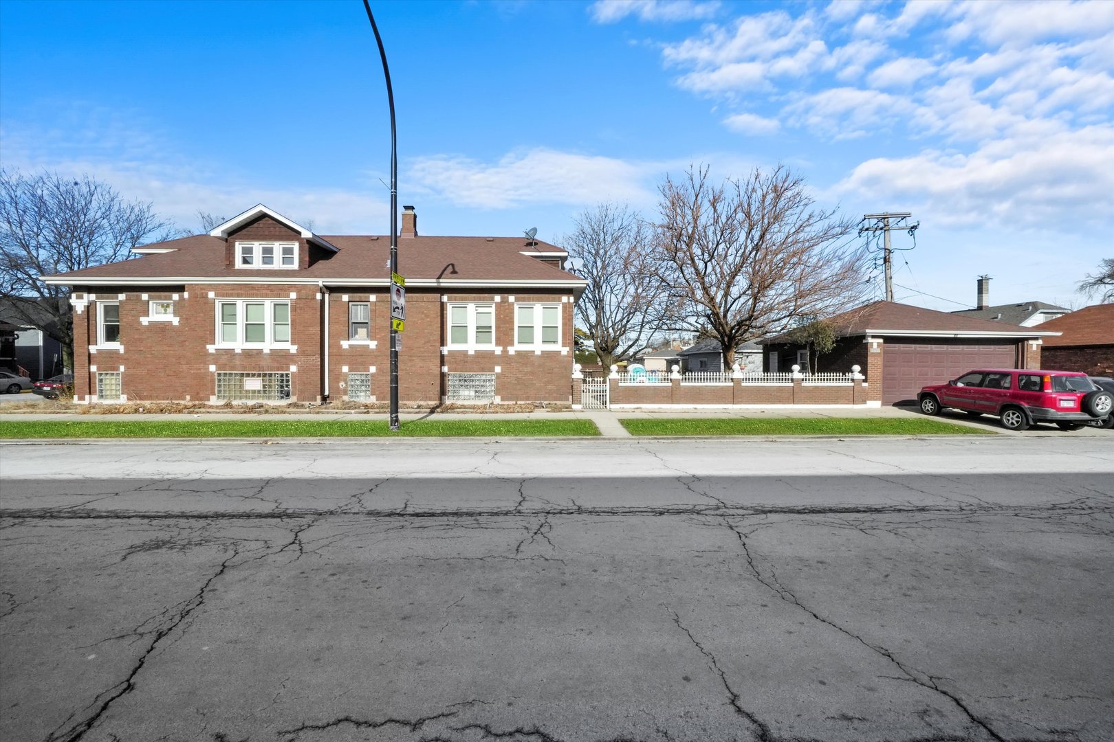 2345 South 59th Court Cicero, IL 60804 - Photo 29 of 36 a view of a big house with a big yard and large trees