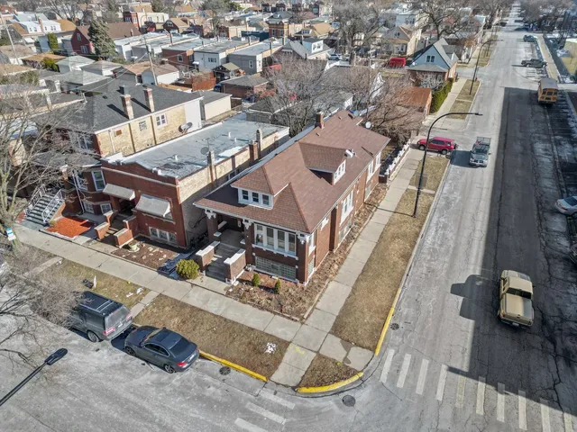an aerial view of a house with a ocean view