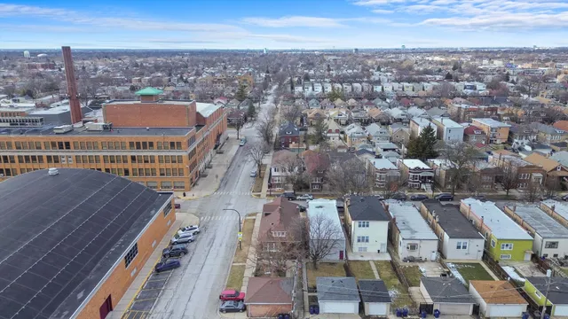 an aerial view of residential houses with city view