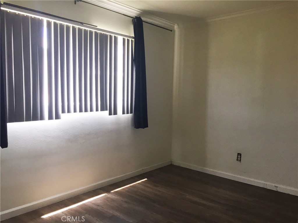 150 East 57th Street, Unit 3 Long Beach, CA 90805 - Photo 3 of 4 a view of a room with wooden floor