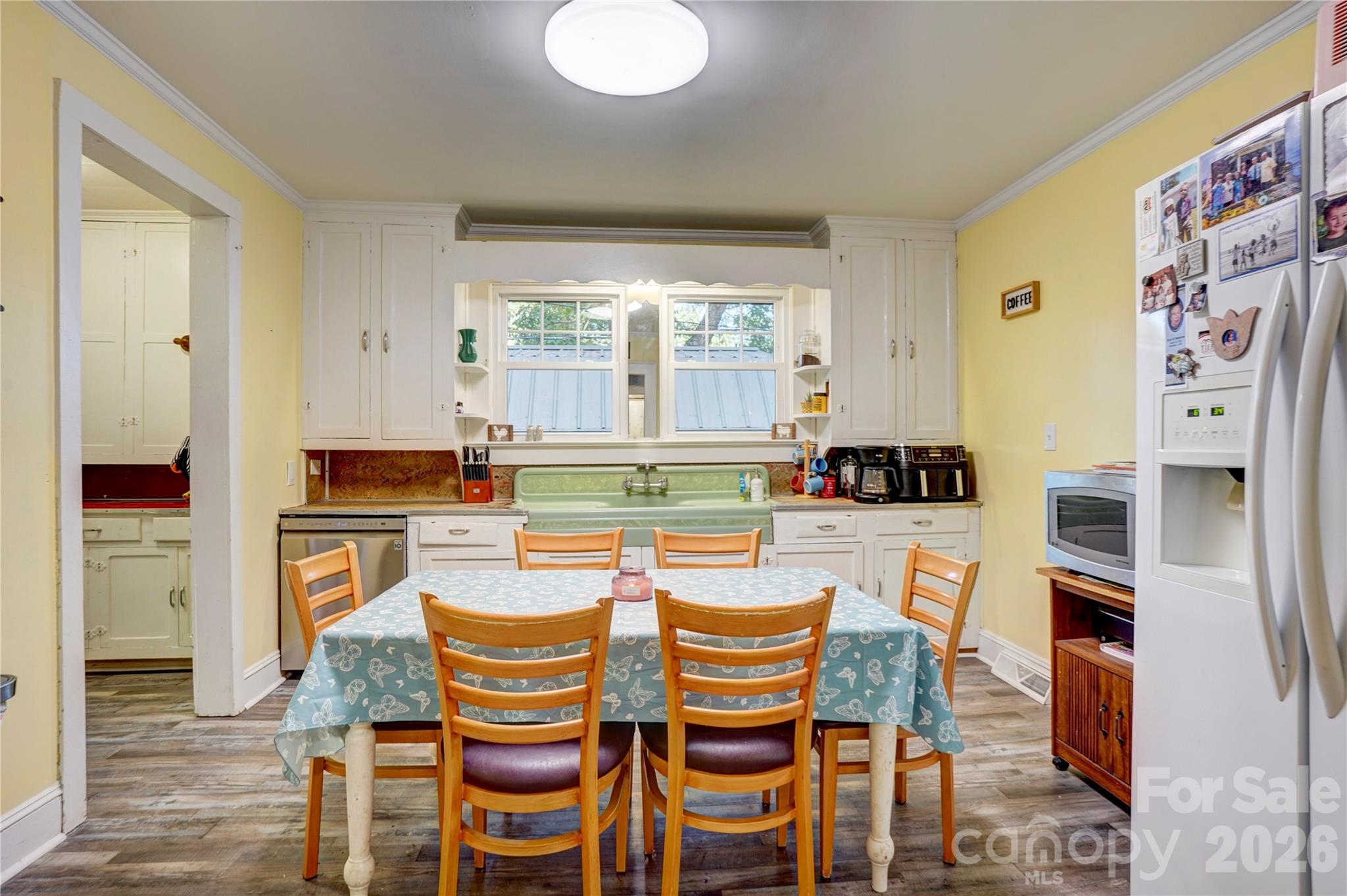 2495 Centergrove Road Kannapolis, NC 28083 - Photo 11 of 36 a dining room with furniture and a kitchen view