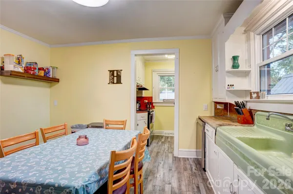 a bedroom with a bed and a television
