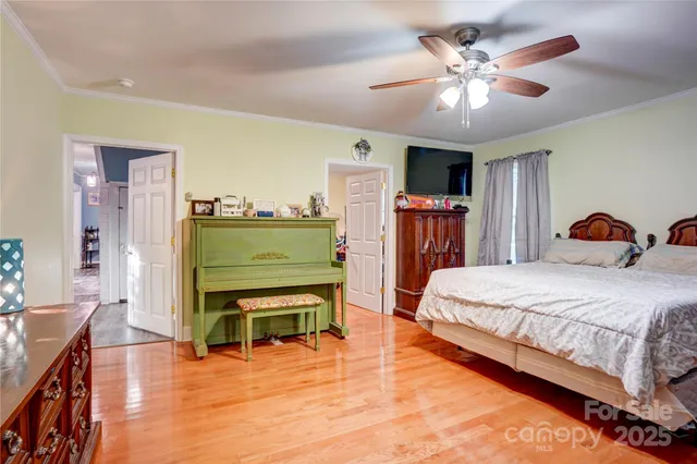 a bedroom with a bed and a television