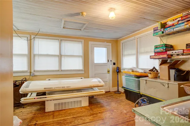 a bedroom with furniture and a window