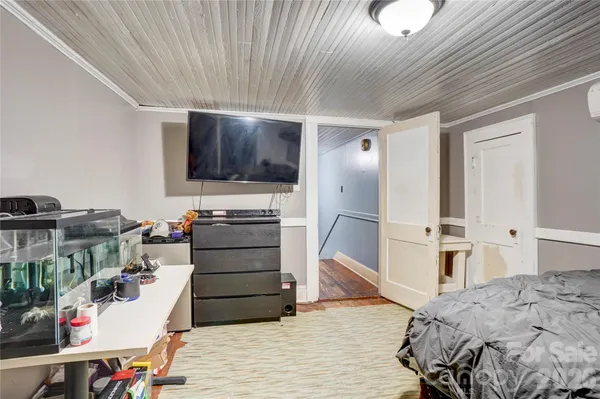 an aerial view of a residential houses with yard