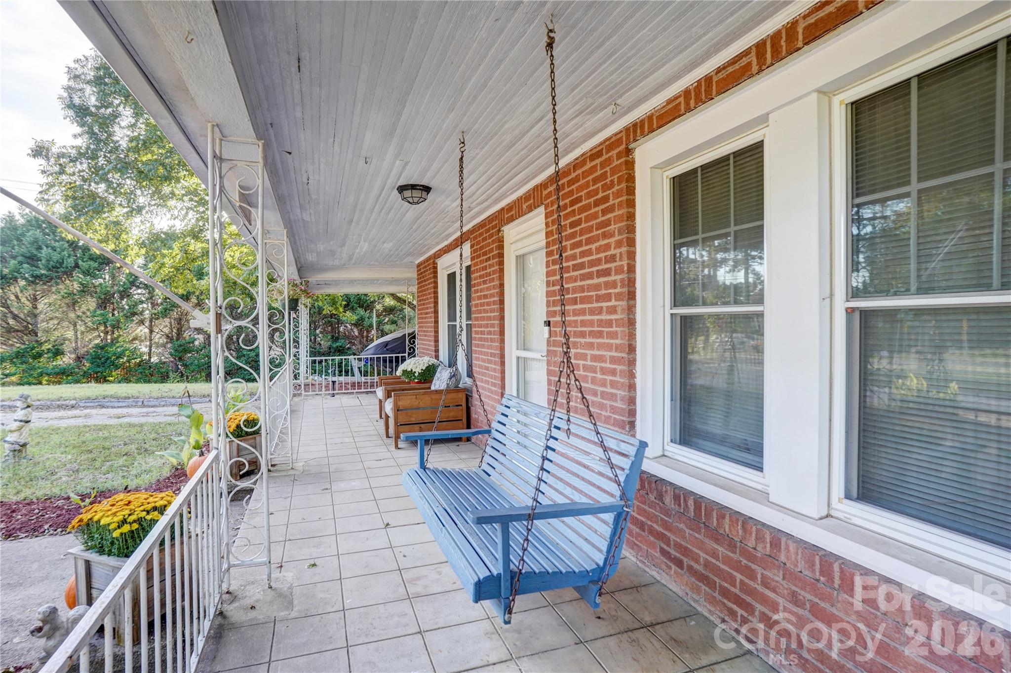 2495 Centergrove Road Kannapolis, NC 28083 - Photo 5 of 36 a view of a deck with chairs and a barbeque grill with couches and wooden fence