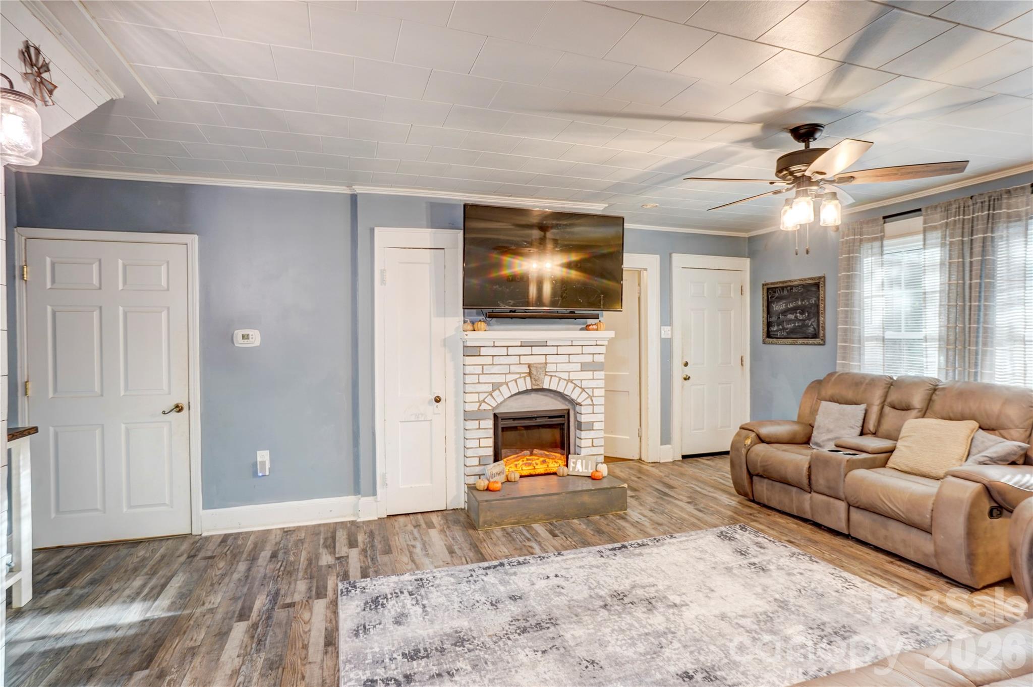 2495 Centergrove Road Kannapolis, NC 28083 - Photo 7 of 36 a living room with furniture fireplace and flat screen tv