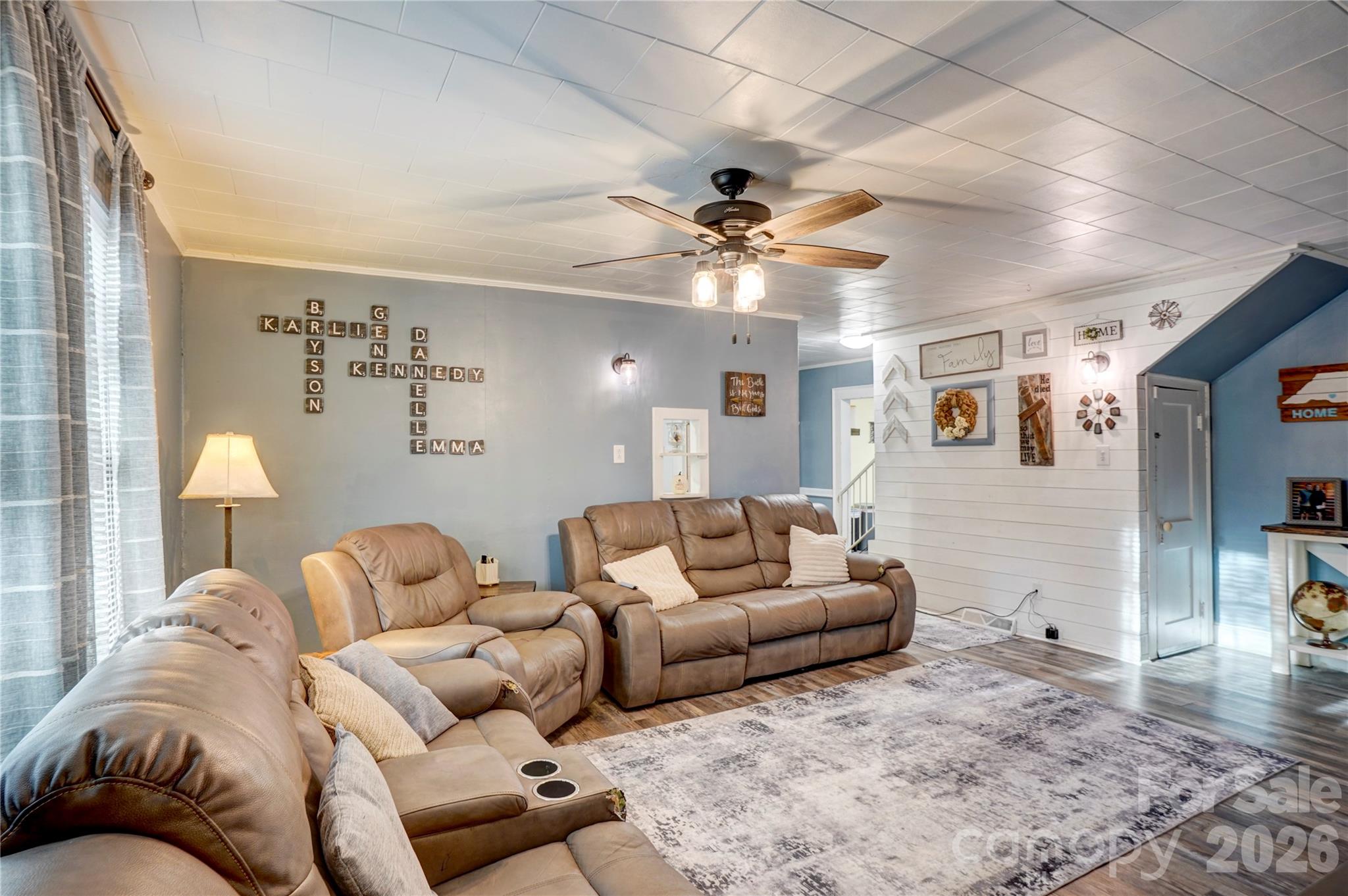 2495 Centergrove Road Kannapolis, NC 28083 - Photo 9 of 36 a living room with furniture ceiling fan and a rug