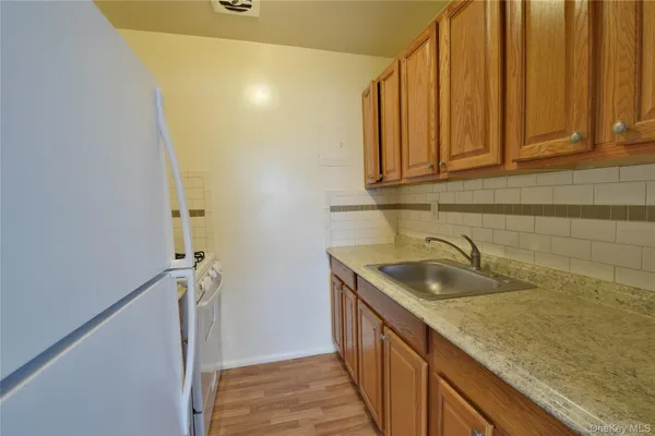 a bathroom with a granite countertop sink and a granite top