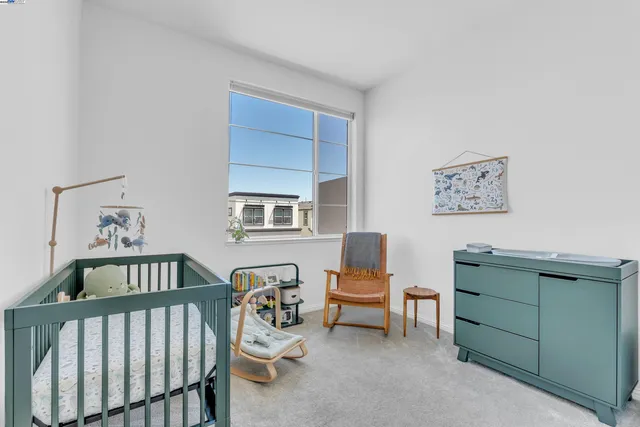 a bedroom with furniture and a window