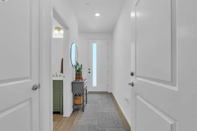 a view of an entryway with wooden floor