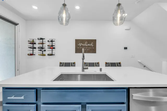 a kitchen with a sink a counter and cabinets