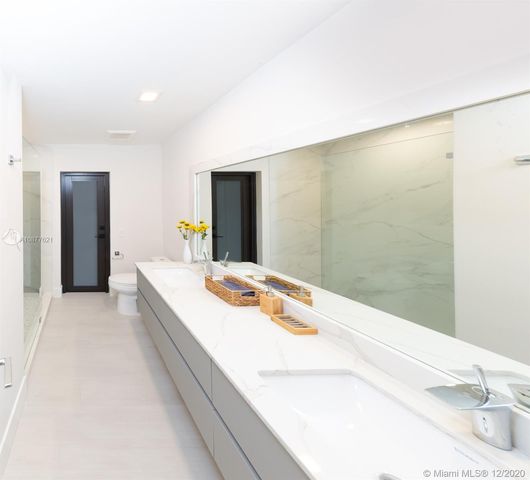 a spacious bathroom with a tub and sink