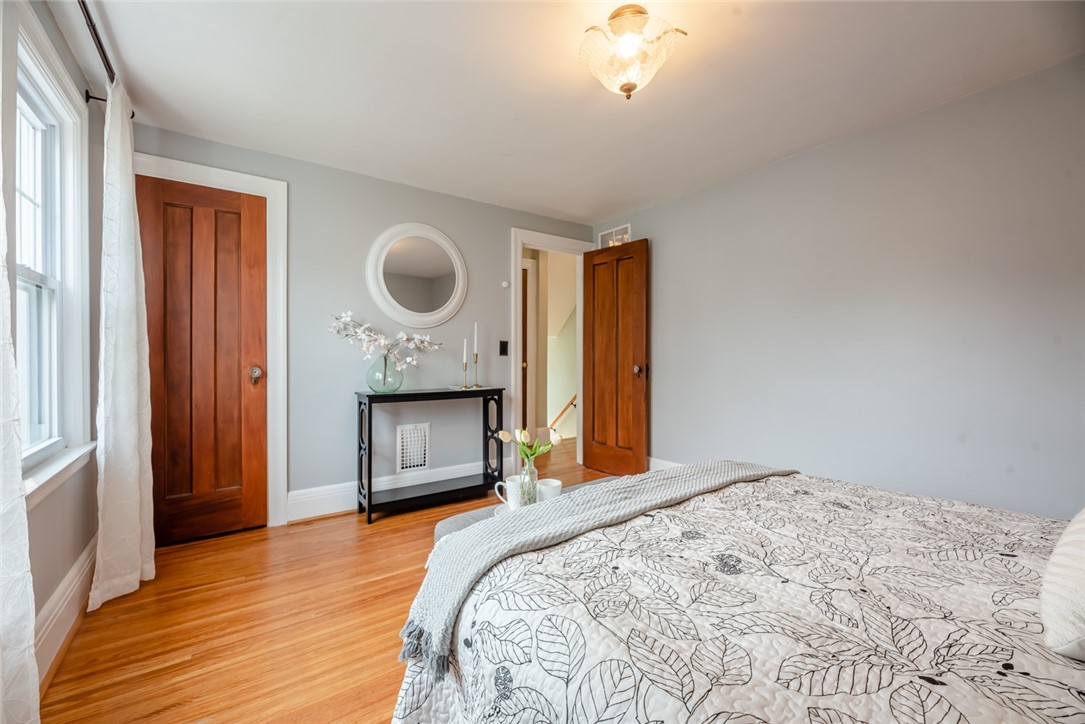 400 Laurelton Road Irondequoit, NY 14609 - Photo 21 of 38 Room for a king, with warm hardwoods underfoot.