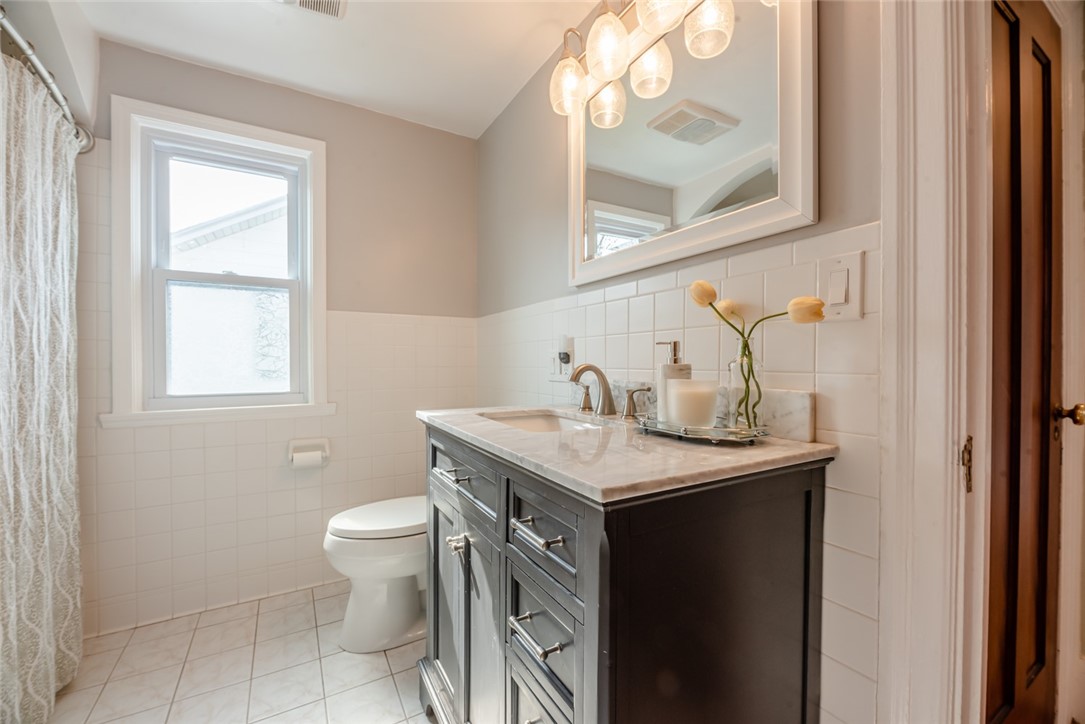 400 Laurelton Road Irondequoit, NY 14609 - Photo 23 of 38 The main family bath is clean and pristine.