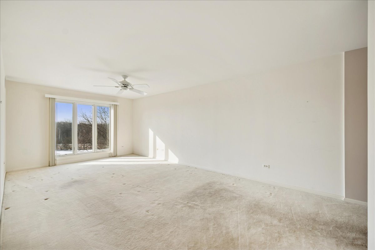 1721 Mission Hills Road, Unit 406 Northbrook, IL 60062 - Photo 15 of 23 an empty room with windows