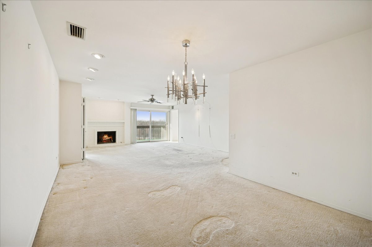 1721 Mission Hills Road, Unit 406 Northbrook, IL 60062 - Photo 8 of 23 a view of a kitchen with a sink and a chandelier