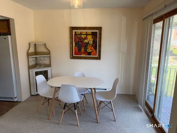 a view of a dining room with furniture window and outside view