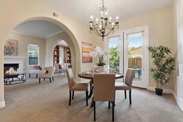 a view of a dining room with furniture window and outside view