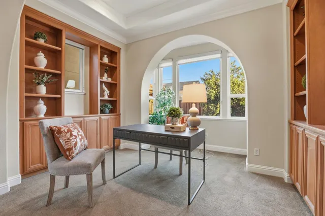 a view of a livingroom with furniture and window