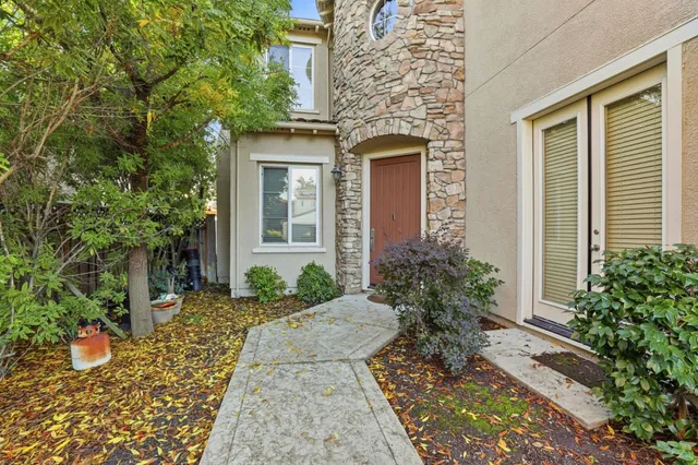 a front view of a house with garden